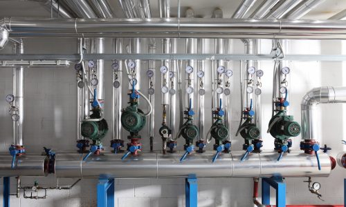 pump , manometer, pipes and faucet valves of heating system in a boiler room pump , manometer, pipes and faucet valves of heating system in a boiler room